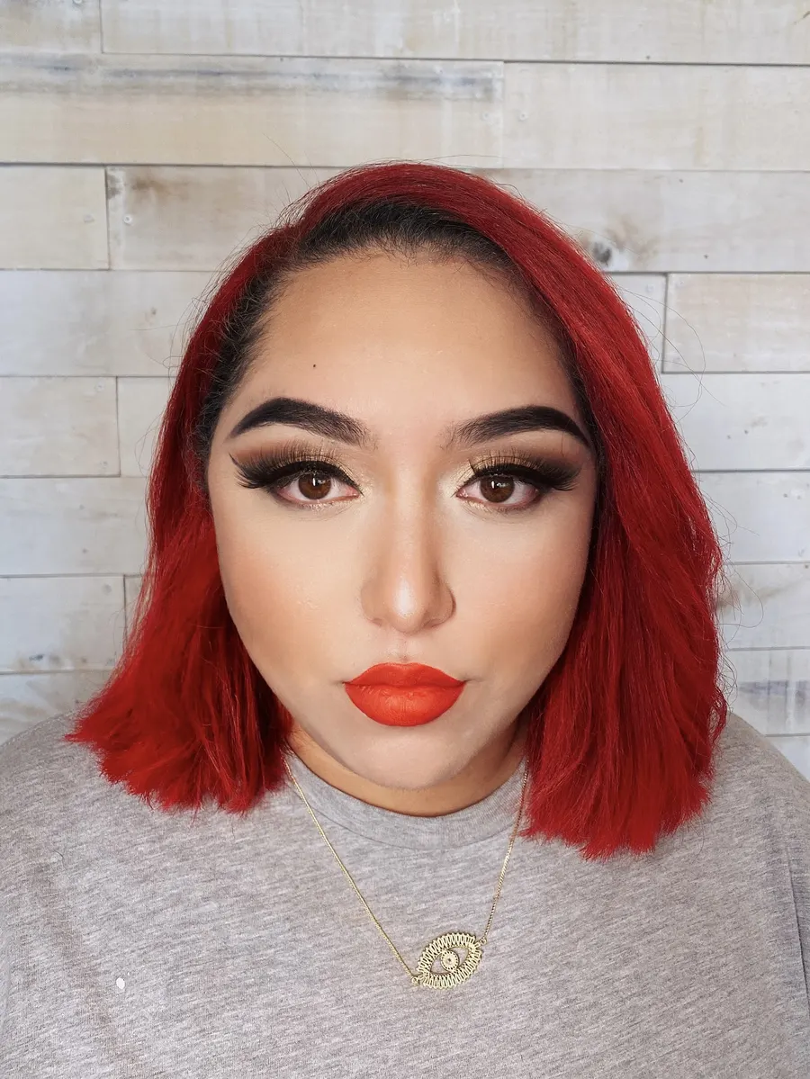 Full glam makeup with a bold red lip
