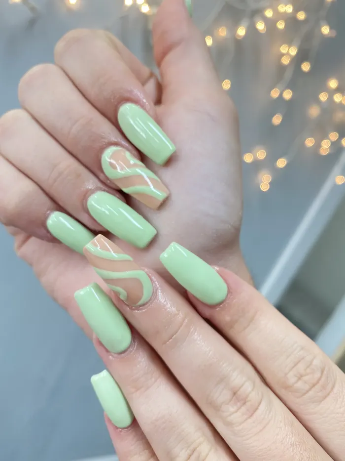 Mint green nails with a swirl accent nail